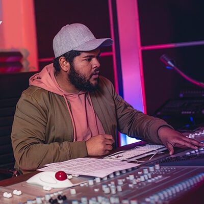 Sound engineers working in music recording studio Audio Engineering School