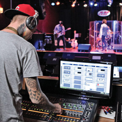 Hipster teen girl student with pink hair watch online webinar learning in bed.